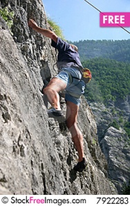 A man rock climbing on a cliff